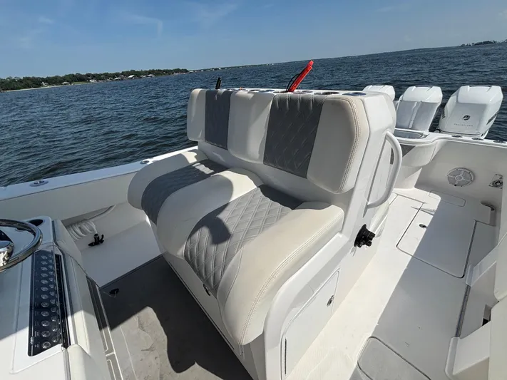  Yacht Photos Pics 2022 Invincible 36 Open Fisherman boat interior with cushioned seating and ocean view.