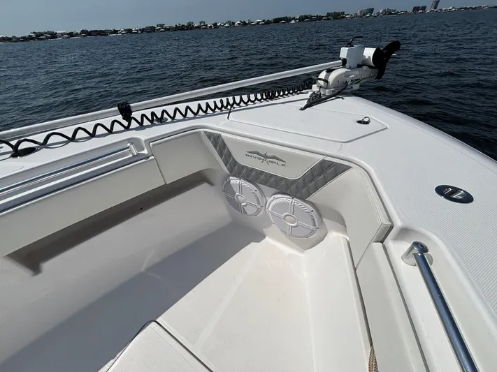  Yacht Photos Pics 2022 Invincible 36 Open Fisherman boat interior with speakers, on calm water.