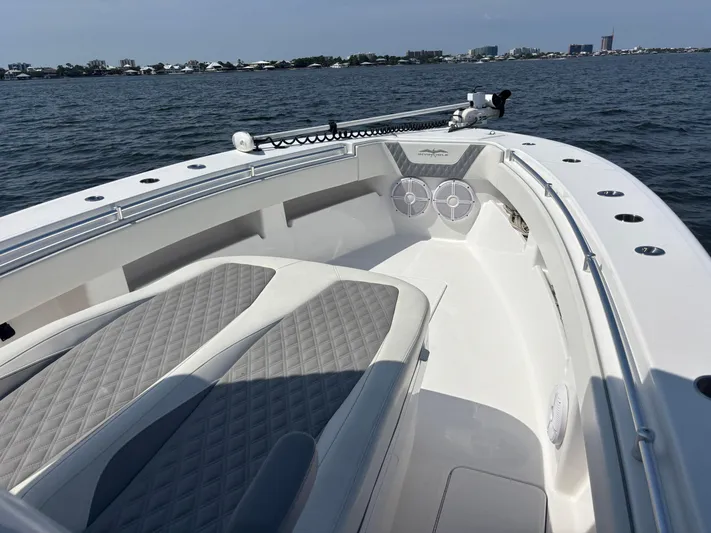  Yacht Photos Pics 2022 Invincible 36 Open Fisherman boat on water, featuring spacious deck and seating.