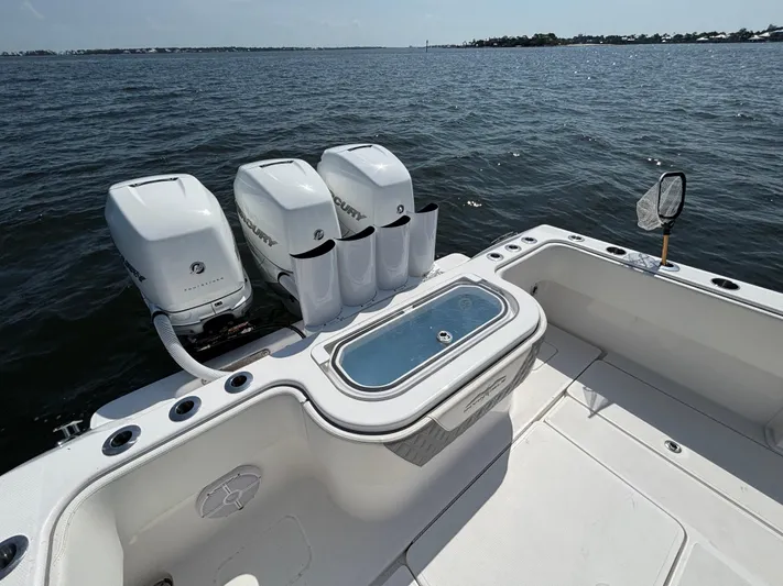  Yacht Photos Pics 2022 Invincible 36 Open Fisherman boat with triple Mercury engines on open water.
