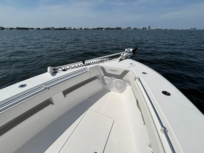  Yacht Photos Pics 2022 Invincible 36 Open Fisherman boat on calm water, featuring spacious deck and modern design.