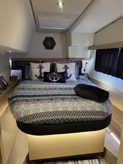 The Flying Tortuga Yacht Photos Pics Cozy bedroom in 2018 Fountaine Pajot Lucia 40 catamaran with nautical-themed decor.