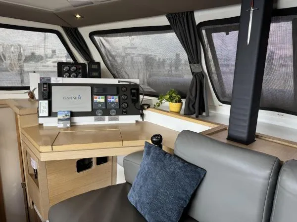 The Flying Tortuga Yacht Photos Pics Interior of 2018 Fountaine Pajot Lucia 40 yacht with navigation equipment and seating area.