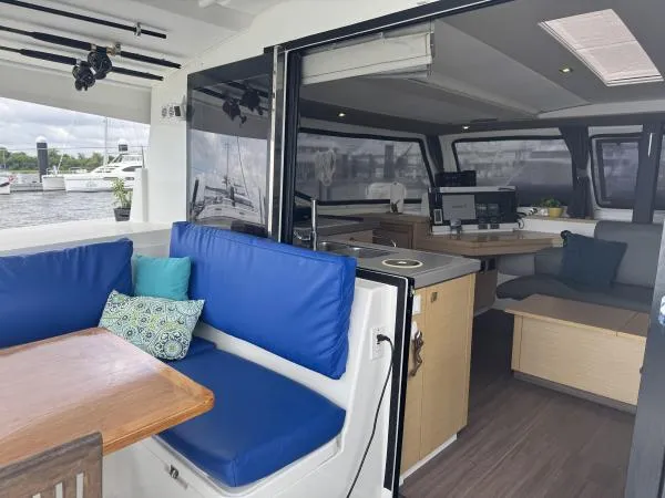 The Flying Tortuga Yacht Photos Pics Interior view of 2018 Fountaine Pajot Lucia 40 catamaran with seating and navigation area.