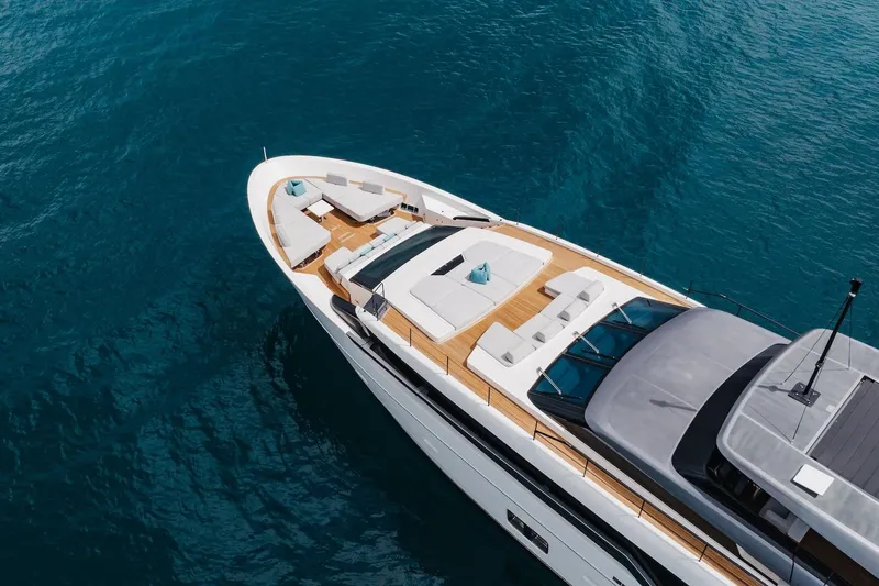 Ambar Yacht Photos Pics Luxurious 2020 Sanlorenzo SLA120A yacht on clear blue water, featuring elegant deck seating.