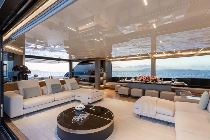 Ambar Yacht Photos Pics Luxurious interior of 2020 Sanlorenzo SLA120A yacht with elegant seating and ocean view.