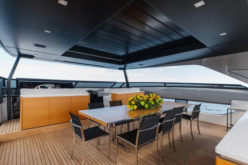Ambar Yacht Photos Pics Luxurious Sanlorenzo SLA120A yacht deck with dining area, modern design, and ocean view, 2020 model.