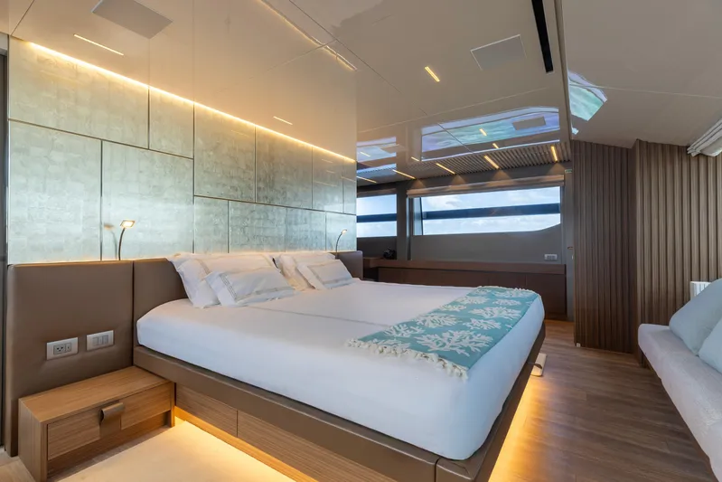 Ambar Yacht Photos Pics Luxurious bedroom interior on 2022 Sanlorenzo SL120A yacht, featuring modern design and ambient lighting.