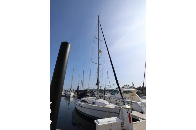  Yacht Photos Pics 2011 Catalina 355 sailboat docked at marina under clear blue sky.
