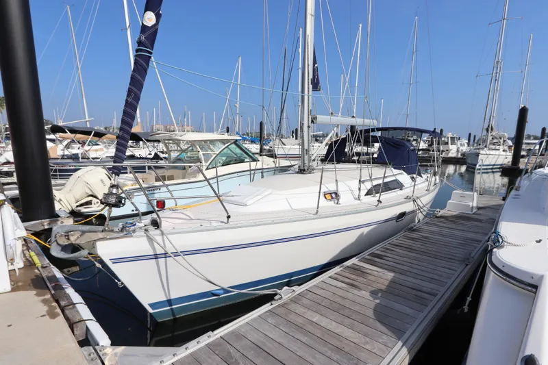  Yacht Photos Pics 2011 Catalina 355 sailboat docked at marina with clear blue sky.