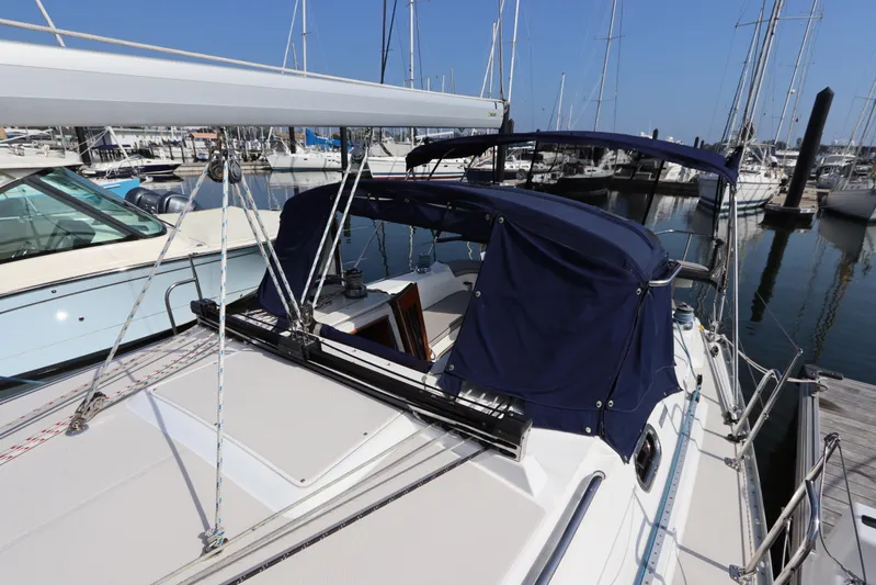  Yacht Photos Pics 2011 Catalina 355 sailboat docked at marina with blue canopy and rigging.