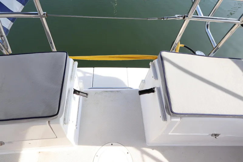  Yacht Photos Pics Stern view of 2011 Catalina 355 sailboat with cushioned seating and railing.