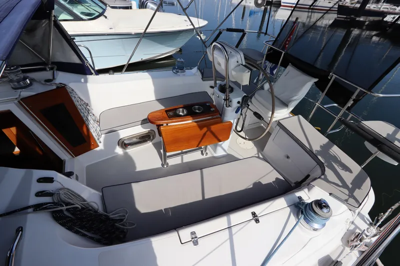  Yacht Photos Pics Cockpit of 2011 Catalina 355 sailboat with seating and steering wheel in marina.