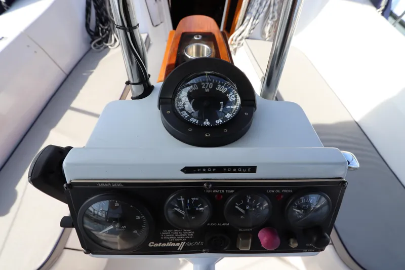  Yacht Photos Pics Cockpit controls of a 2011 Catalina 355 yacht, featuring navigation instruments and gauges.