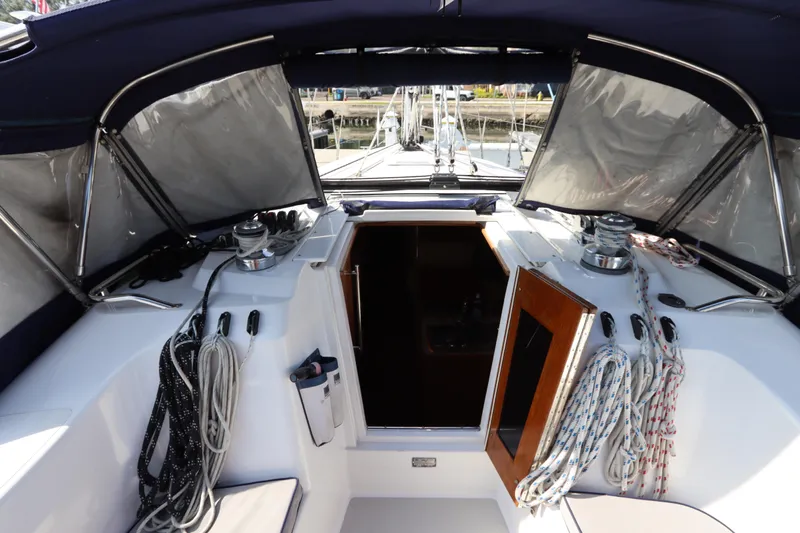  Yacht Photos Pics Cockpit of 2011 Catalina 355 sailboat with ropes and open cabin door.