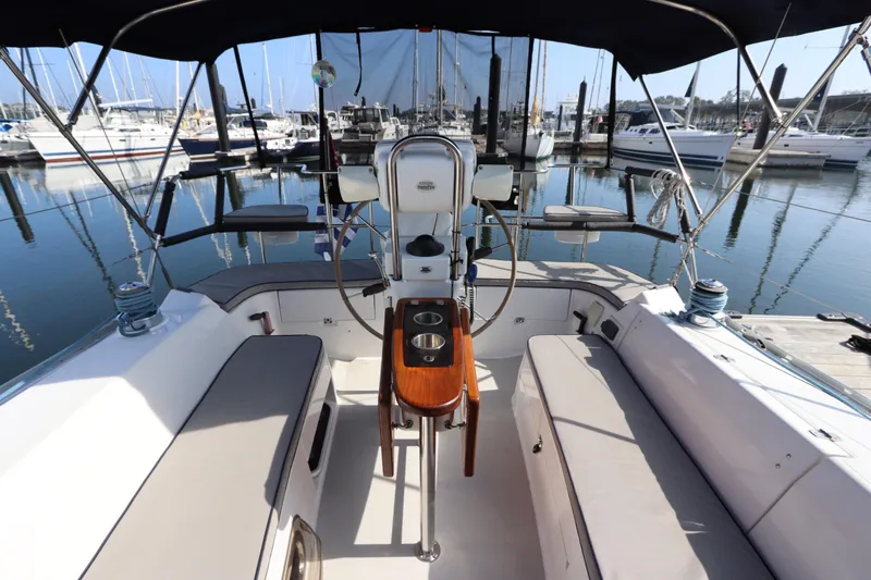  Yacht Photos Pics Cockpit of 2011 Catalina 355 sailboat docked at marina, featuring comfortable seating and steering wheel.