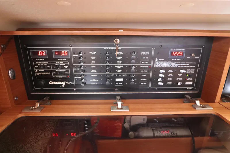  Yacht Photos Pics Control panel of a 2011 Catalina 355 yacht, featuring various switches and digital displays.