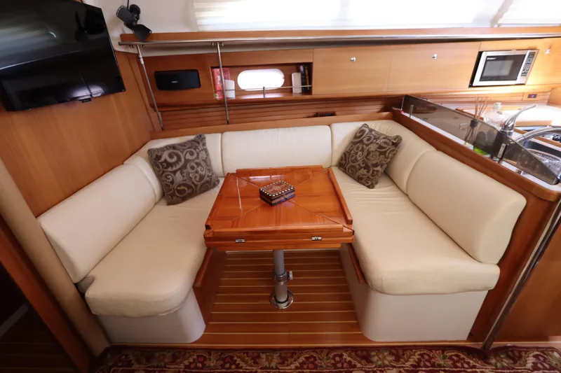  Yacht Photos Pics Luxurious interior of 2011 Catalina 355 yacht with cozy seating and elegant wood finish.
