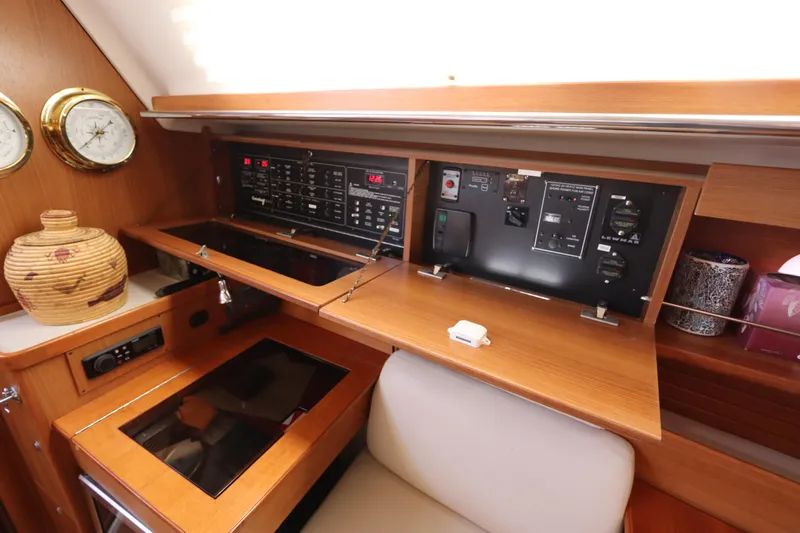 Yacht Photos Pics 2011 Catalina 355 yacht interior with control panel and wooden cabinetry.