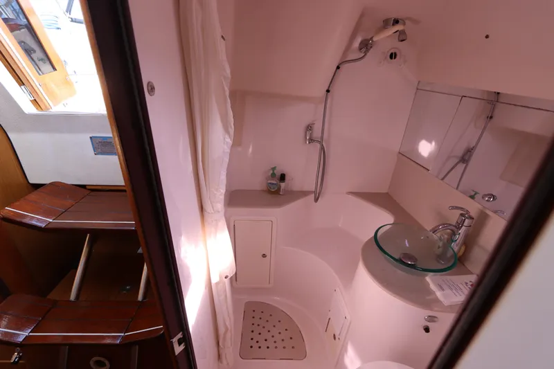  Yacht Photos Pics Bathroom interior of 2011 Catalina 355 sailboat with shower and glass sink.