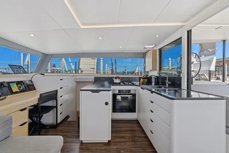 Navitas Yacht Photos Pics Modern kitchen interior of 2019 Itacatamarans 14.99 yacht with sleek design and appliances.