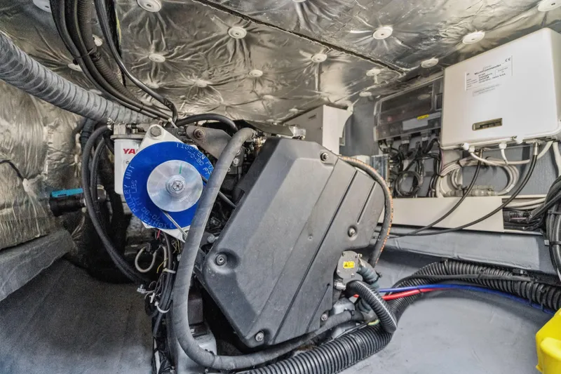 Navitas Yacht Photos Pics Engine room of a 2019 Itacatamarans 14.99, showcasing mechanical components and wiring.