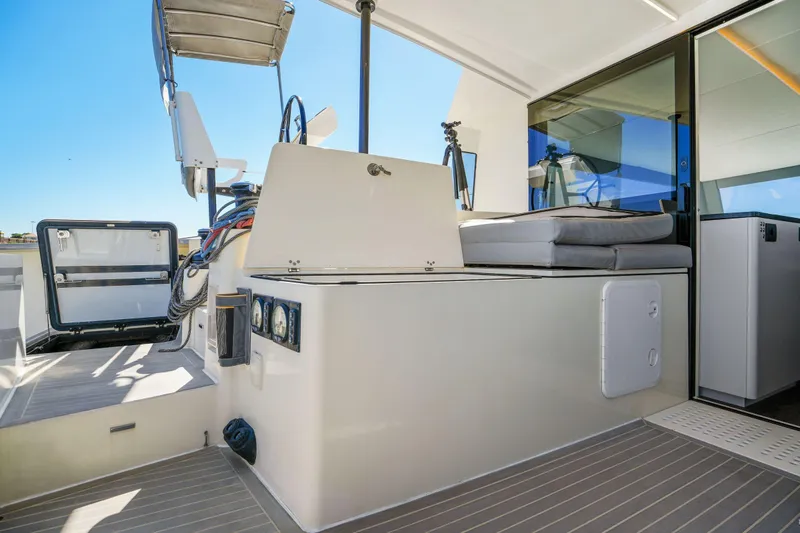 Navitas Yacht Photos Pics 2019 Itacatamarans 14.99 yacht interior with modern seating and navigation equipment.
