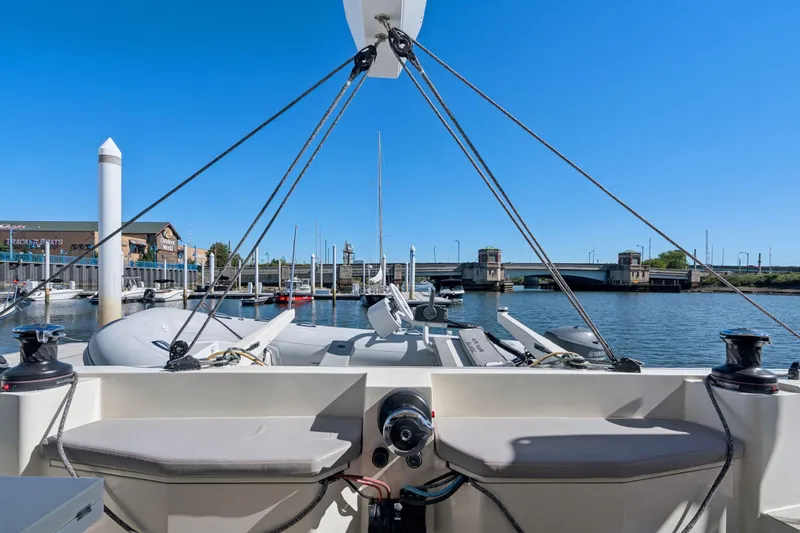 Navitas Yacht Photos Pics 2019 Itacatamarans 14.99 catamaran docked at marina with clear blue sky.