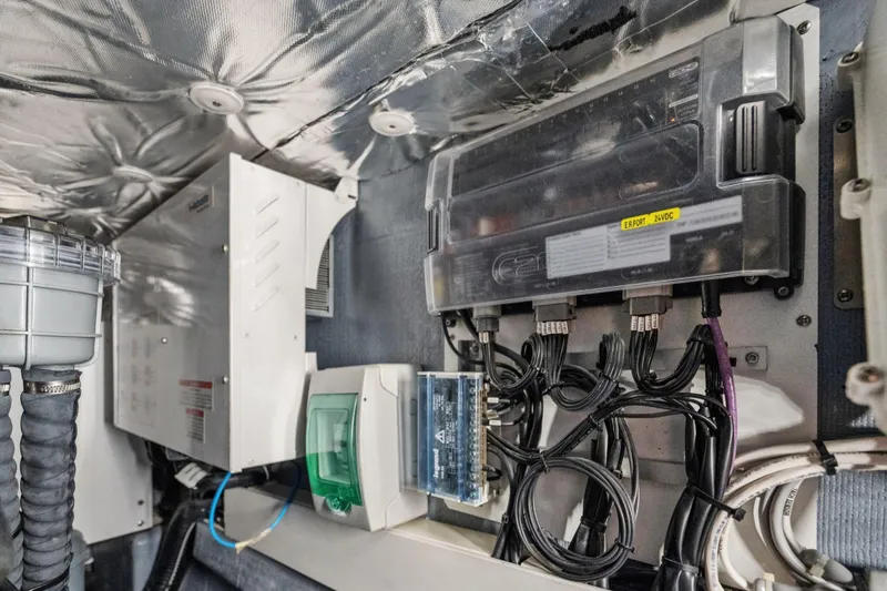 Navitas Yacht Photos Pics Electrical system inside a 2019 Itacatamarans 14.99, featuring cables and control panels.