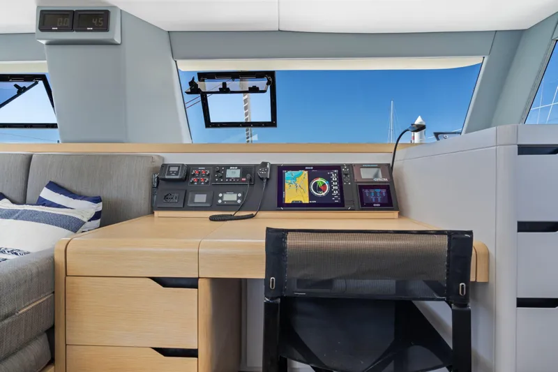 Navitas Yacht Photos Pics Modern navigation station on 2019 Itacatamarans 14.99 with control panels and ocean view.