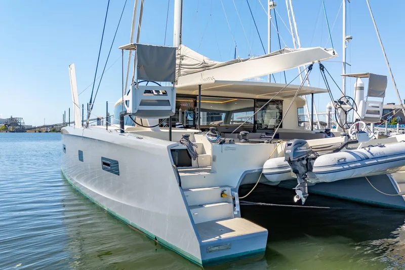 Navitas Yacht Photos Pics 2019 Itacatamarans 14.99 catamaran docked in a marina, featuring modern design and equipment.