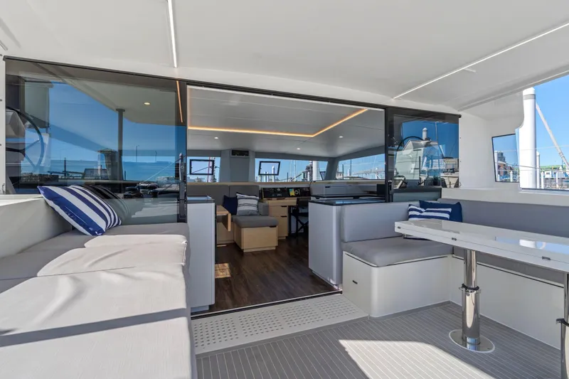 Navitas Yacht Photos Pics Luxurious 2019 Itacatamarans 14.99 yacht interior with modern seating and sleek design.