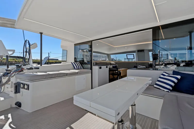 Navitas Yacht Photos Pics Luxurious 2019 Itacatamarans 14.99 yacht interior with modern seating and navigation area.