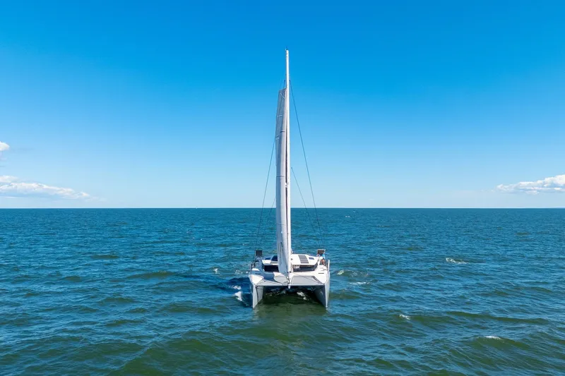 Navitas Yacht Photos Pics 2019 Itacatamarans 14.99 sailing on open sea under clear blue sky.