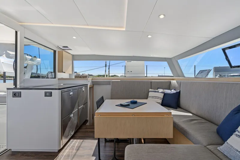 Navitas Yacht Photos Pics Luxurious interior of 2019 Itacatamarans 14.99, featuring modern seating and sleek design.