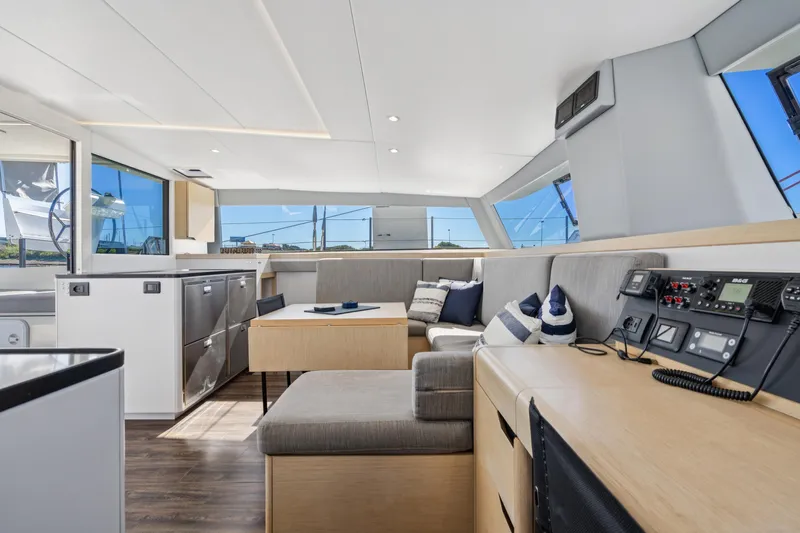 Navitas Yacht Photos Pics Luxurious interior of 2019 Itacatamarans 14.99, featuring modern design and navigation equipment.