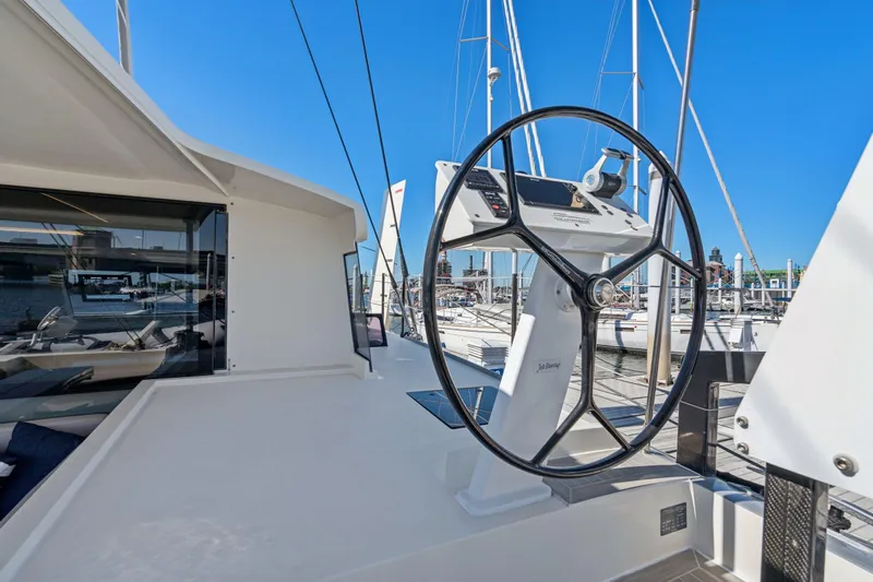 Navitas Yacht Photos Pics Steering wheel of 2019 Itacatamarans 14.99 catamaran docked at marina.