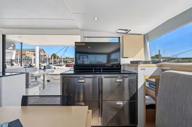 Navitas Yacht Photos Pics Luxurious interior of 2019 Itacatamarans 14.99 with modern kitchen and outdoor view.