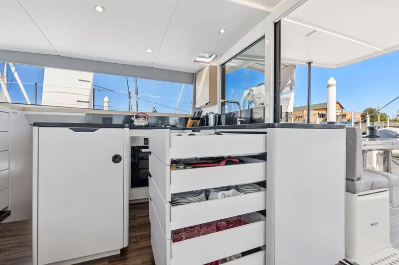 Navitas Yacht Photos Pics Modern kitchen interior on 2019 Itacatamarans 14.99 yacht, featuring sleek cabinetry and appliances.
