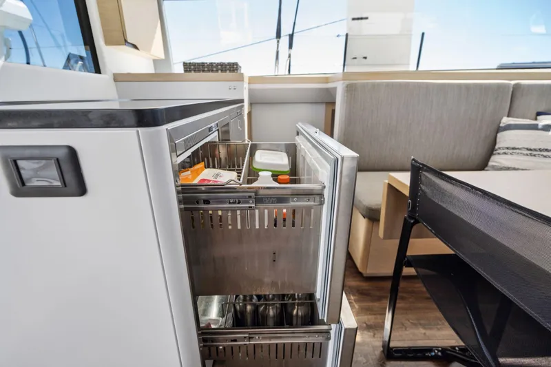 Navitas Yacht Photos Pics Modern kitchen interior of 2019 Itacatamarans 14.99 with open drawer fridge.