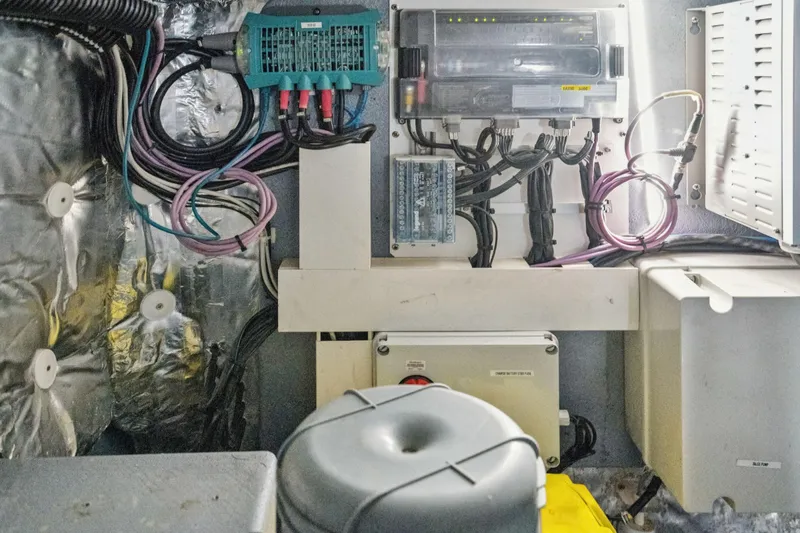 Navitas Yacht Photos Pics Electrical system inside a 2019 Itacatamarans 14.99, featuring wiring and control panels.