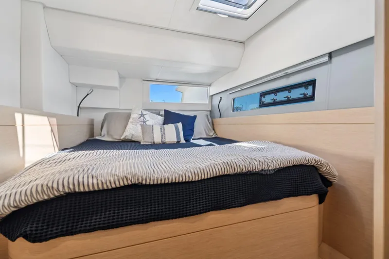 Navitas Yacht Photos Pics Luxurious bedroom interior of 2019 Itacatamarans 14.99 with modern design and cozy bedding.