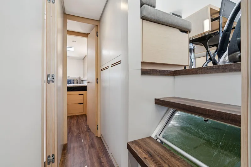 Navitas Yacht Photos Pics Interior of 2019 Itacatamarans 14.99, featuring modern design and wooden flooring.