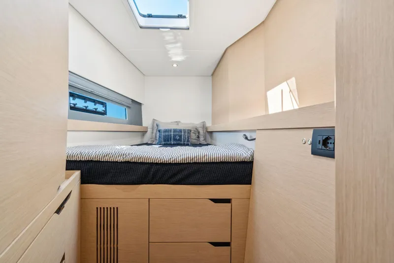 Navitas Yacht Photos Pics Modern cabin interior of 2019 Itacatamarans 14.99 with skylight and cozy bed.