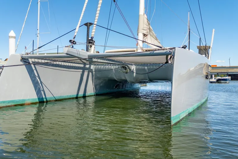 Navitas Yacht Photos Pics 2019 Itacatamarans 14.99 catamaran docked in a marina, viewed from the front.