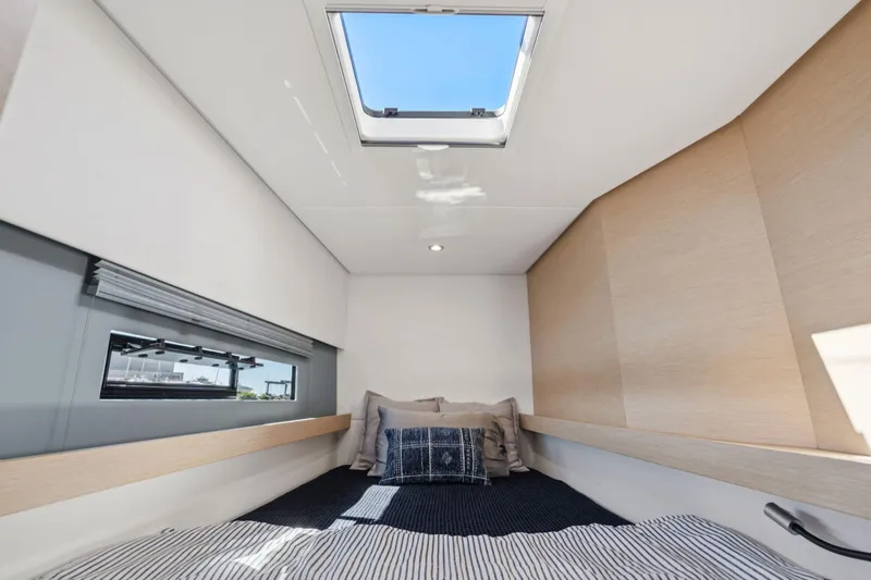 Navitas Yacht Photos Pics Cozy cabin interior of 2019 Itacatamarans 14.99 with skylight and modern design.