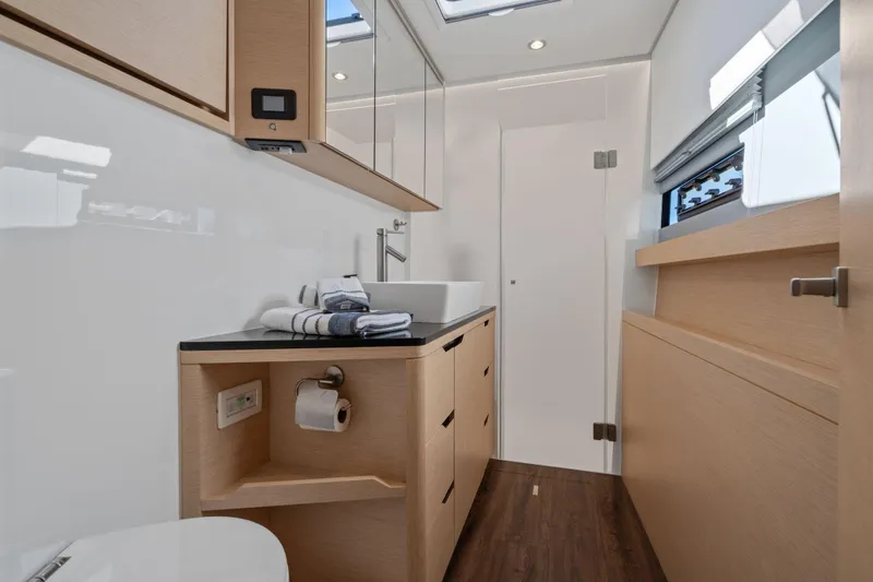 Navitas Yacht Photos Pics Luxurious bathroom interior of 2019 Itacatamarans 14.99, featuring modern fixtures and elegant design.