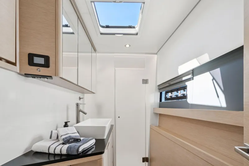 Navitas Yacht Photos Pics Modern bathroom interior of 2019 Itacatamarans 14.99 yacht with skylight and sleek design.