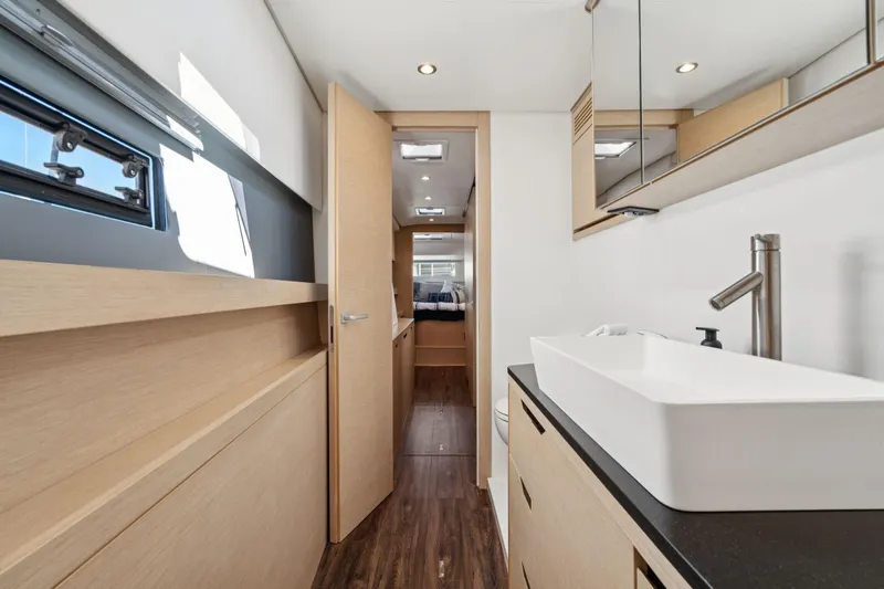 Navitas Yacht Photos Pics Modern bathroom interior on 2019 Itacatamarans 14.99 yacht, featuring sleek design and fixtures.