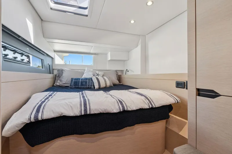 Navitas Yacht Photos Pics Cozy bedroom interior of 2019 Itacatamarans 14.99, featuring modern design and natural light.